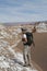 Backpacker exploring the Moon Valley in Atacama Desert, Chile