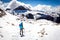 Backpacker female tourist standing alone looking at mountains landscape