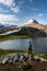 Backpacker Girl admires beautiful Helen Lake and Cirque Peak Banff National Park Alberta