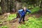 Backpacker man in mountain forest