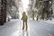 Backpacker posing in winter mountains