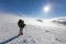 Backpacker is posing in winter mountains