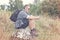 Backpacker sitting on a rock