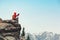 backpacker taking photo on mountain peak