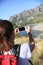 Backpacker taking photo with smartphone in Patagonia