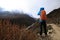 Backpacker taking photo while trekking at the himalaya mountains