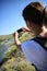 Backpacker taking pihotos of Limay river, Patagonia