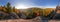 Backpacker on top of a rock fall at dawn. Cylindrical panorama 360 degrees