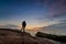 Backpacker watching a sunrise at Acadia National Park