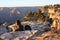 Backpacker watching sunrise over Grand Canyon