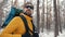 Backpacker in winter woods portrait