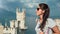 Backpacker woman enjoying amazing seascape ancient castle surrounded by sea and mountains