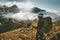 Backpacker woman enjoying mountains clouds