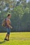 Backpacker young man walking in a park area of Biscane Bay, North Miami, USA