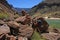 Backpackers on backcountry trail by Colorado River in Grand Canyon.