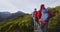 Backpackers Hiking At Sunset By Mountains At Routeburn Track New Zealand