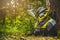 Backpackers lay in the deep, rich green forest. This picture is about a traveler studying nature