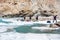 Backpackers and porters walking on frozen Zanskar river. Chadar Trek. Leh. India