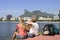 Backpackers tourists in Rio de Janeiro looking at Christ the Redeemer.