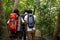 Backpackers trekking in a forest