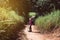 Backpacking asian woman walking with trekking pole in the morning at outdoor,Camping hiking concept