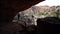 Backpacking Woman Crosses Desert Bridge Away From Camera