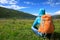 Backpacking woman hiking in mountains