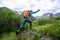 Backpacking woman jumping