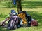 Backpacks of Boy Scouts around the tree during an excursion