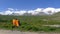 Backpacks and holy snow mountain Anymachen on Tibetan Plateau