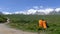 Backpacks and holy snow mountain Anymachen on Tibetan Plateau