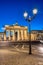 The backside of the illuminated Brandenburg Gate in Berlin at dawn