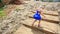 Backside Little Blond Girl Climbs High Stone Steps in Park