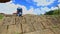 Backside Little Blond Girl Climbs up Slope Waves Closeup