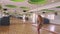 Backside View Long Haired Blond Girl Dances on Floor by Pole