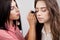 Backstage scene: Professional Make-up artist doing makeup for yo