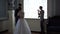 Backstage wedding photography - professional photographers take pictures of newlyweds in a chic room