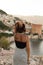 Backview portrait of fit woman enjoying the view of the bay of A