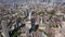 Backwards reveal of city. Aerial footage of skyscrapers in Elephant and Castle borough. Tall modern buildings towering