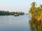 A Backwater Canal with Houseboat and Palm Trees, Kerala, India - A Natural Background