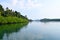 Backwater with Mangroves on Banks with Clear Water and Blue Sky - River on Great Andaman Trunk Road, Baratang Island, India