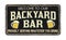 Backyard bar vintage rusty metal sign