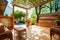 Backyard deck with wicker furniture and pergola.