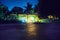 Backyard at night with house and lightened rooms, Bacalar, Mexico