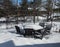 Backyard outdoor table and chairs in winter