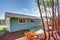 Backyard Patio view of a lovely blue remodeled home