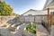 Backyard with raised bed garden and wooden fence and gate