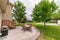 Backyard relax area with green trees and table