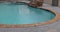 Backyard swimming pool opening with water before cleaning