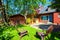 Backyard view with concrete patio and small shed.